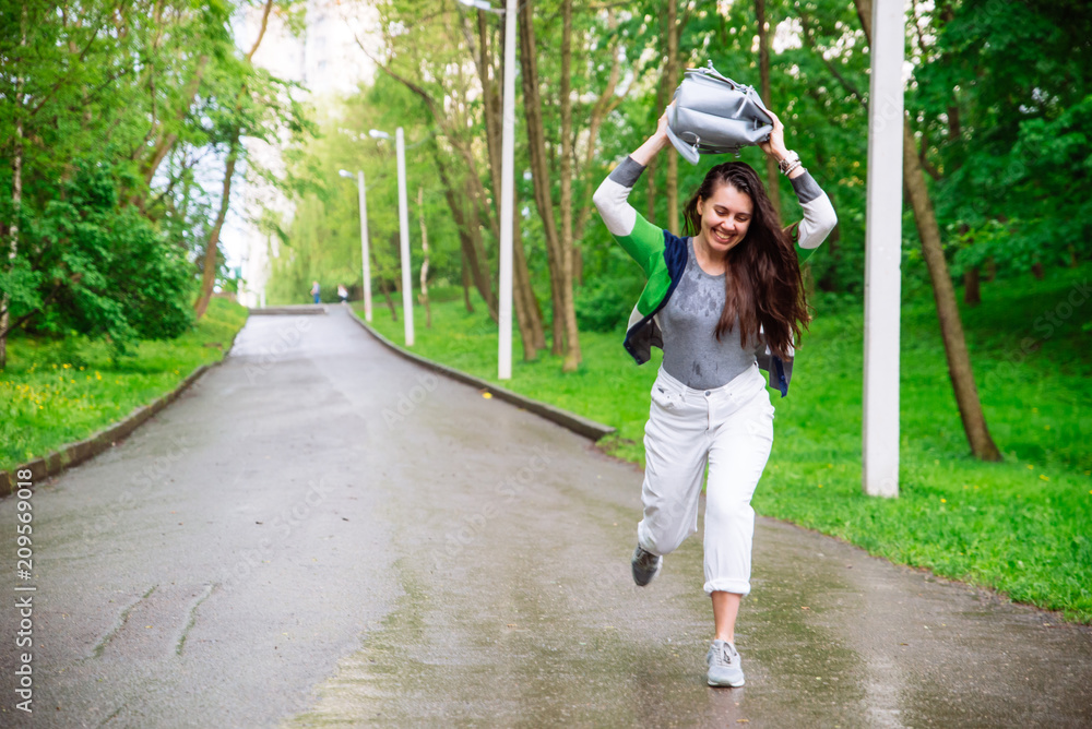 Wall mural portrait of young adult woman wet after rain. smiling