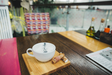 cheese cream soup close up on wooden cafe table