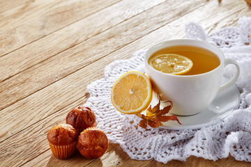 white cup of tea with cookies on a wooden background white cup of tea with cookies on a wooden background. copy space.