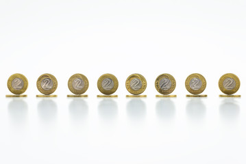Standing coins, the Polish currency 2  PLN / Polish zloty. Isolated on white background with clipping path(without a shadow).