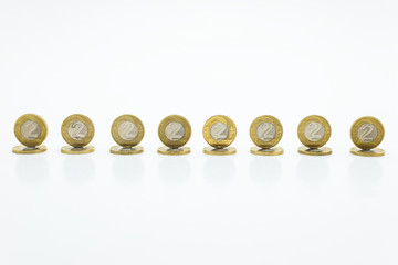 Standing coins, the Polish currency 2  PLN / Polish zloty. Isolated on white background with clipping path(without a shadow).