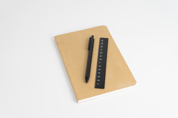 Stationery set such as Note books Ruler and Pens on white background.