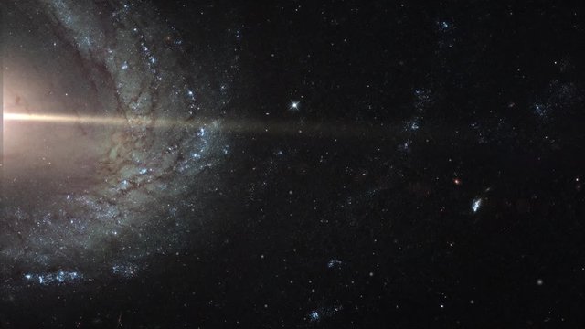 Spiral galaxy ngc1512 slow rotating near twin galaxy ngc1510 in outer space, 3D animation. Contains public domain image by NASA