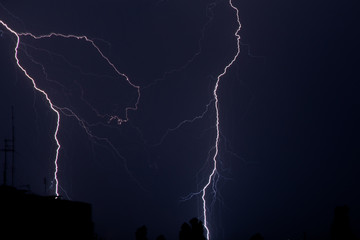 thunderstorm and lightning on a summer night over a sleeping city