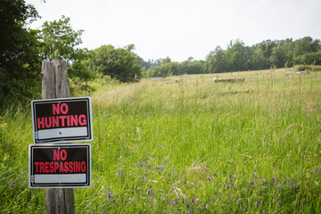old private property no trespassing sign in canadian countryside