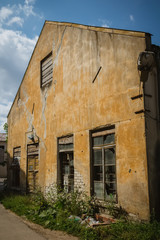 old abandoned stone house with sophisticated windows