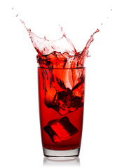 Splash of gorgeous cherry juice in glass with ice cubes