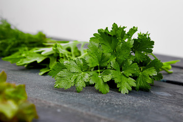 Mix leaf salad on black table.