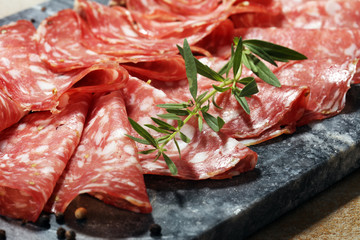 thinly sliced salami . delicious snack rustic salami