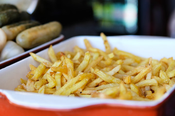 French fries in street side restaurant. Street food and outdoor cooking concept