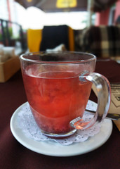 Сup with Fruit Tea is on the table in a restaurant