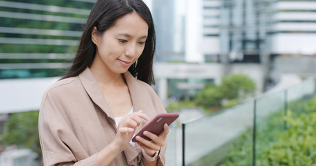 Woman using smart phone at outdoor