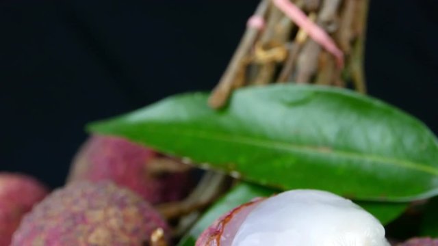 4k Close up ,Tilt down shot of red exotic Chinese lychee fruits 

