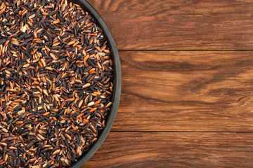 Black rice in pan