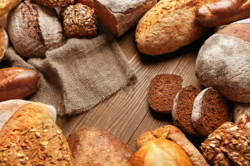 Naklejka premium Bread Variety Still Life. Bakery Food On Wooden Table