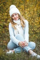 Young attractive woman in autumn colorful background