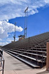 Stadium Bleachers with Blue Sky and Clouds