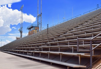 Stadium Bleachers with Blue Sky and Clouds