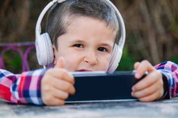 boy listening to music on the outside
