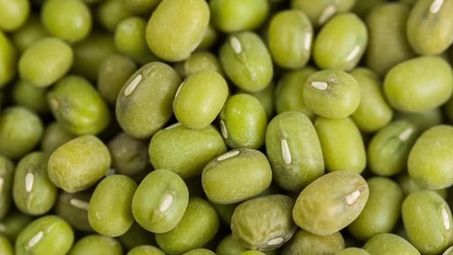 Green mung bean in wooden bowl. Macro. Turntable rotating shot. Close up. Top view