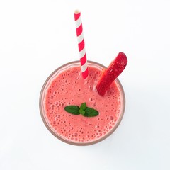 Strawberry milkshake in glass isolated on white background. Top view.