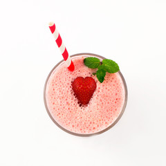 Strawberry milkshake in glass isolated on white background. Top view.