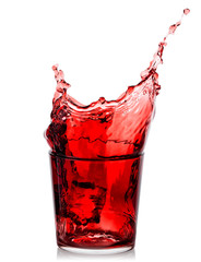 Splash of cherry juice in low glass