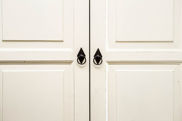 Vintage white wooden cupboard doors with metal handles