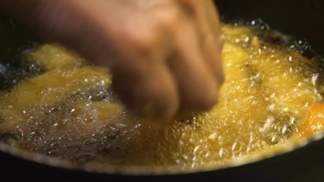 Christmas dinner: frying the cod - close up