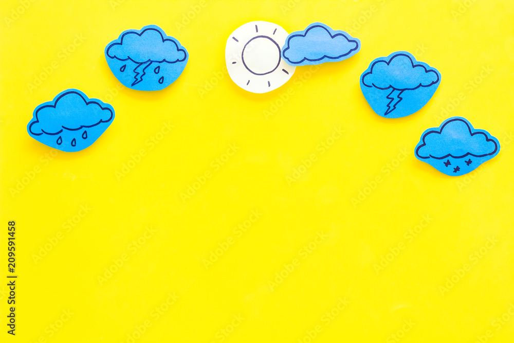 Wall mural modern weather icons set on yellow background top view copy space