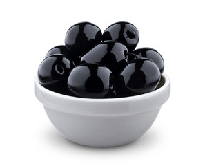 Black olives in bowl isolated on white background with clipping path