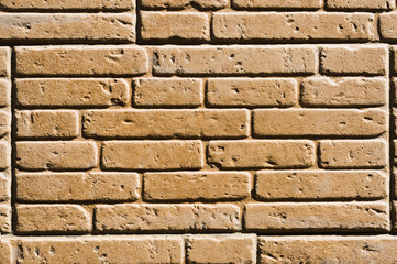 A tile imitating a brickwork of beige color. Textured background