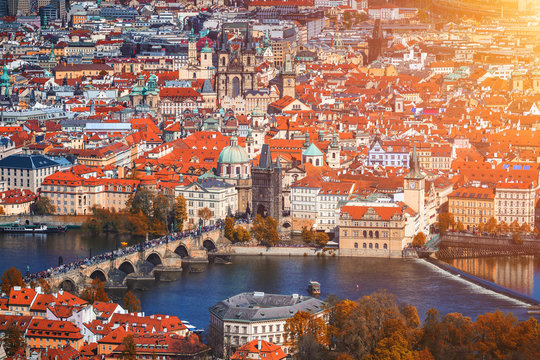 Autumn aerial view of houses and roofs of Prague old city town including Charles bridge. Czech Republic
