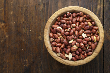 peanuts in a wooden plate