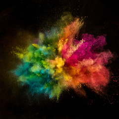 Obraz na płótnie Canvas Colored powder explosion on black background.