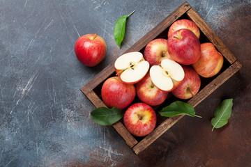Red apples in wooden box