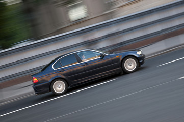 Obraz premium The car goes at high speed with blur