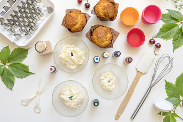 on white background cake molds, spatula, corolla, cones for cream,