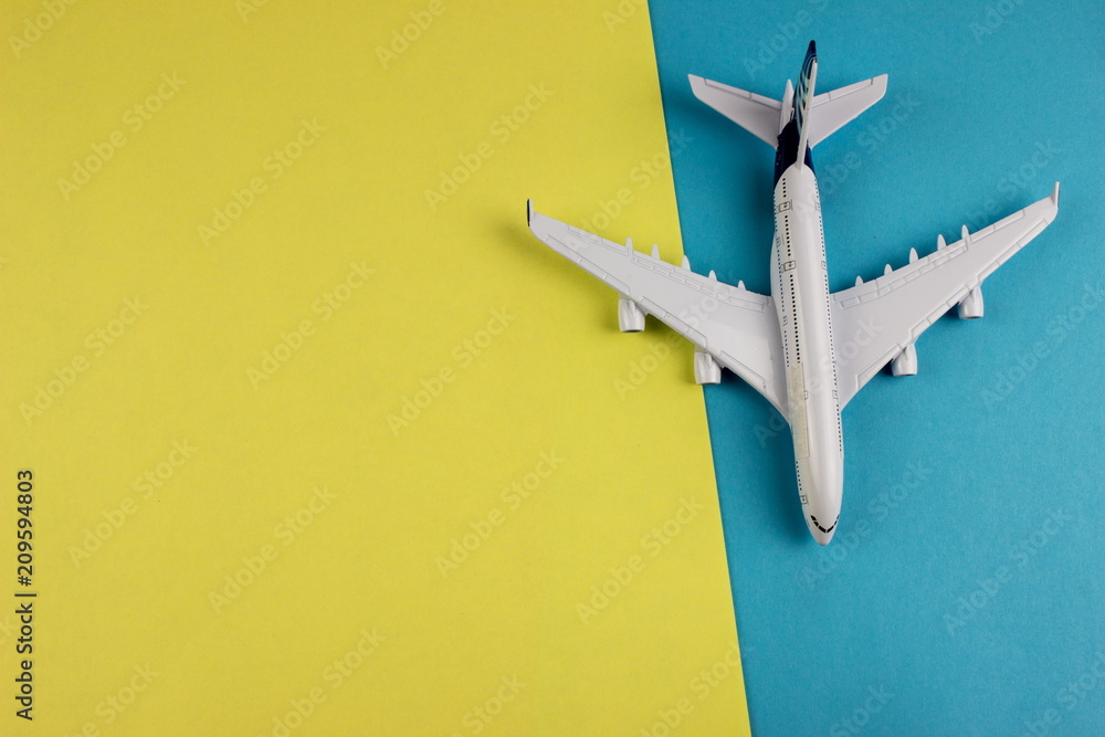 Poster travel concept with plane on color paper background. copy space for text and design