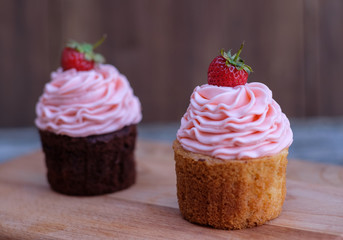 chocolate and banana cupcakes on a wooden Board