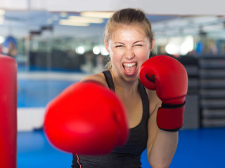 Portrait of  woman who is training in box gym.