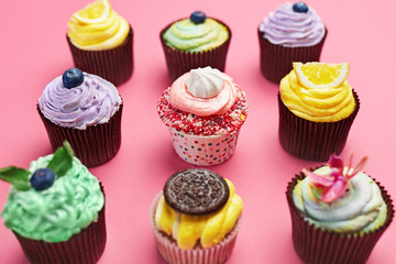 Colorful Cupcakes On Pink Background