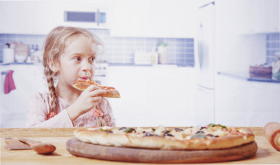 I love pizza! Cute little child girl eating pizza.