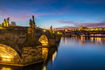 Fototapeta na wymiar Famous Charles bridge in the sunset light, beautiful scenary and one of the iconic landmarks in Prague. Czech Republic.