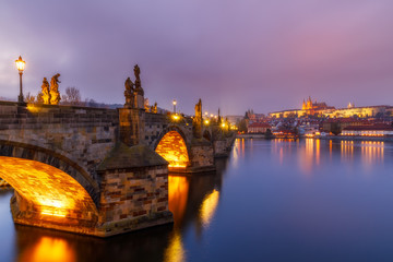 Fototapeta na wymiar Charles Bridge (a.k.a. Karluv most, Stone Bridge, Kamenny most, Prague Bridge, Prazhski most) over Vltava river in Prague, Czech Republic.