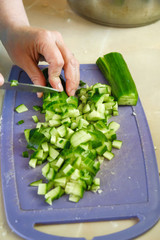 the chef cuts green salad