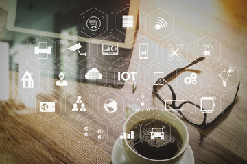 Coffee cup and Digital table dock smart keyboard,eyeglasses,stylus pen on wooden table,filter effect