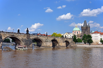 View from the Vltava River to Charles Bridge, the Old Town Tower and the Church of St. Francis of Assisi. Prague, Czech Republic, Europe, UNESCO.