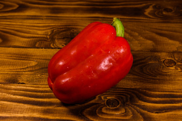 Red bulgarian pepper on a wooden table