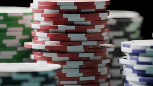 Casino chips or tokens forming stacks on a green gaming table. Winning. 4k